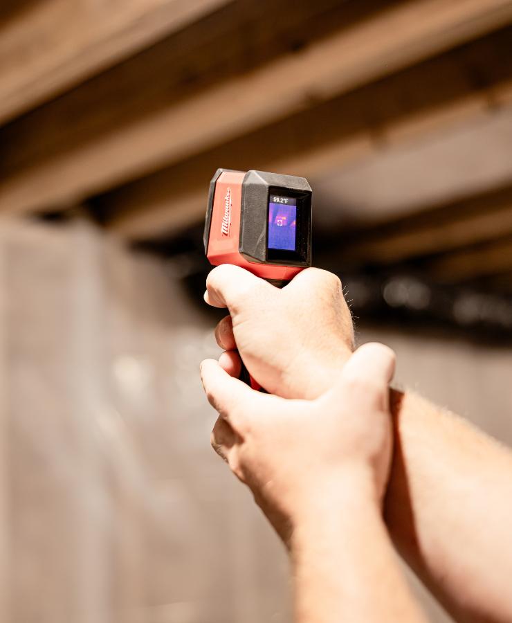 hands holding thermal detector